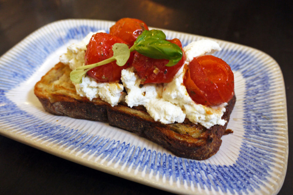Tomato bruschetta with slow-roasted cherry tomatoes, buffalo ricotta, basil & extra virgin olive oil