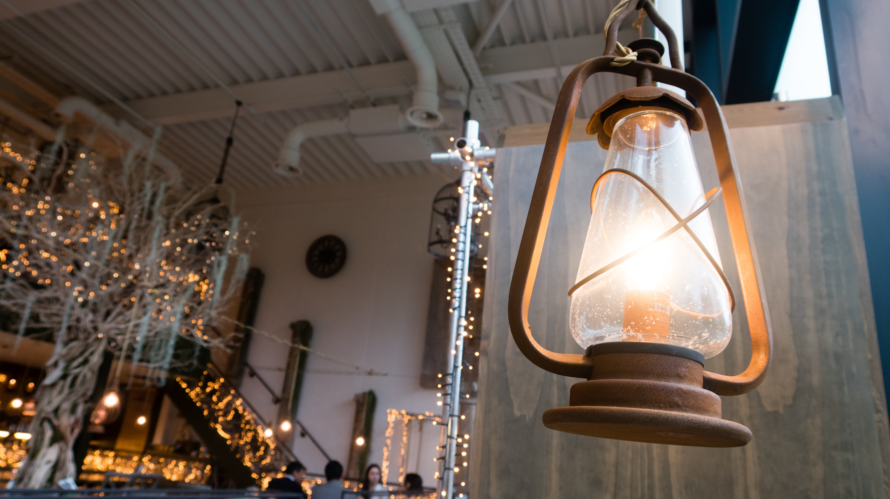 A lantern lights some of the tables